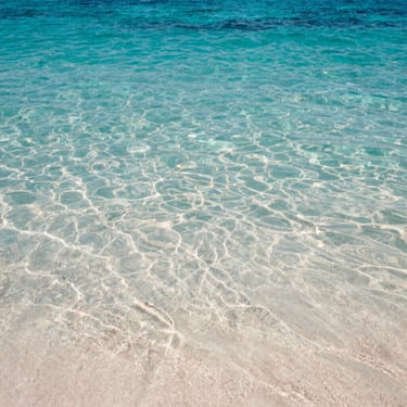 A clear-water seaside on Sithonia with Sail boat Christina