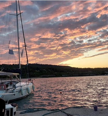 Sail Boat Christina anchored during a beautiful sunset cruise in Halkidiki