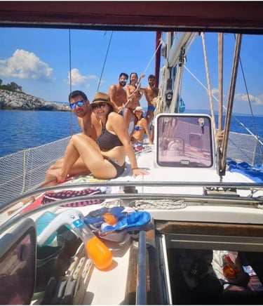 Guests enjoying a full-day private sailing cruise aboard Sail Boat Christina in Halkidiki