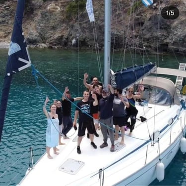 Guests enjoying a private sailing cruise aboard Sail Boat Christina in a secluded bay in Halkidiki