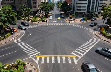 A wide-angle photography showing the finished results of a complex road marking project at a major intersection in a modern South Asian city.