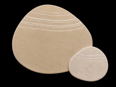 Two modern pebble shaped area rugs in beige with white line patterns on a black background.