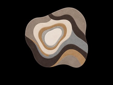 Modern irregular shaped area rug with a wavy abstract topography pattern in neutral earth tones.