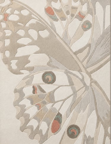 Cream butterfly-inspired rug with muted sage and coral wing details