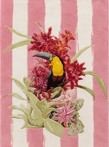 A tropical toucan bird perched among red and pink flowers on a pink and white striped background.