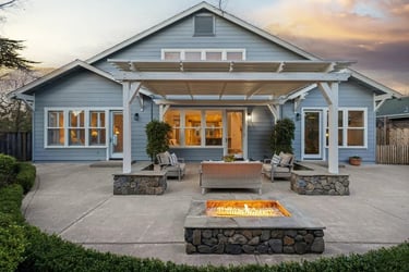 Outdoor patio with custom stone design and firepit on a concrete slab