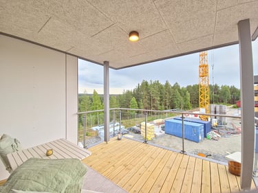 Modern wooden apartment balcony overlooking a forest. Coffe table and charming atmosphere