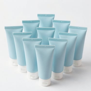 Several tubes of gel facial cleanser arranged on orange background.