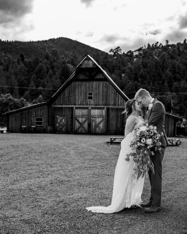 couple outside barn
