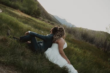 Bride and Groom in Grassy Field