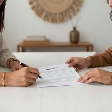 Close-up of hands reviewing a strengths and potential analysis report together.