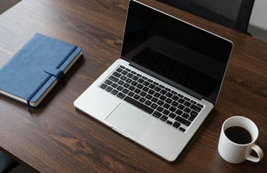 A top-down view of a high-end, organized executive desk in a North American / US office. The shot includes a sleek laptop, a soft blue notebook, and a white coffee mug, symbolizing professional precision.