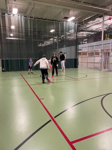 A group of volunteers and children play an soccer game adapted to be inclusive to all children