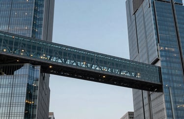 Modern architectural detail of a glass and steel bridge connecting two financial towers, symbolic of transatlantic connection, North American / European business context, evening lighting.