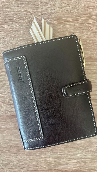 Filofax Pocket Ring Planner in black leather for organized daily tasks and rituals