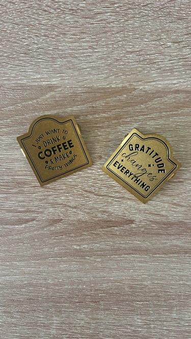 Vintage brass clips holding open a planner for a beautiful journaling aesthetic.