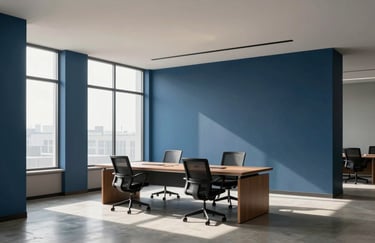 A minimalist North American office interior showcasing a clean workspace with deep blue architectural accents and soft natural morning light, wide shot, professional.