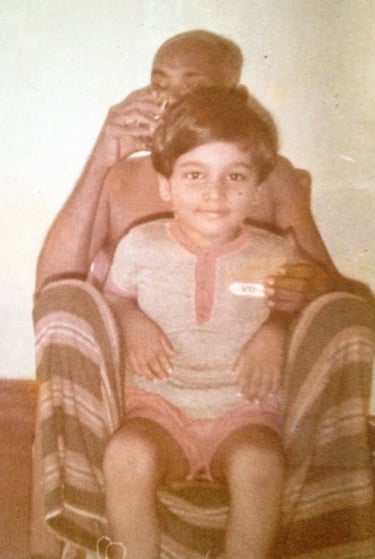 Pappa with his favourite nephew, Oshan, sitting on a "sarong hammock"