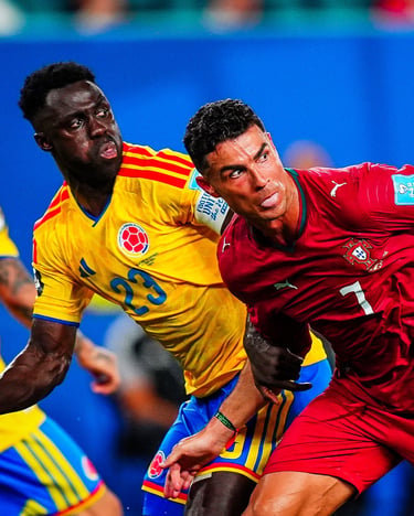 Cristiano Ronaldo in a Portugal jersey competing for the ball against a Colombian soccer player during a match.