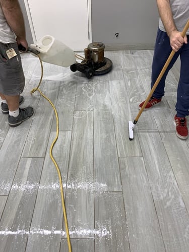 Surgical clinic floor being deep cleaned and scrubbed