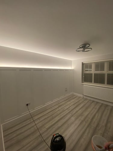 Bedroom renovation with panelled feature wall and LED lighting