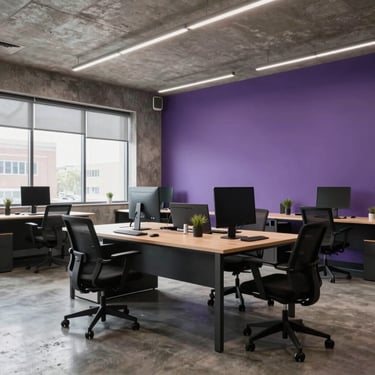A wide shot of a clean, minimalist marketing agency workspace in a US metropolitan area, featuring polished concrete and purple accent walls.