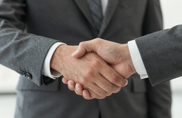 A high-quality, close-up shot of a firm handshake between two individuals in professional attire, signifying a pact of trust and integrity. The lighting is warm and steady, with a color palette focusing on deep greys (#262626) and neutral off-whites (#F2F4F3), conveying solid commitment.