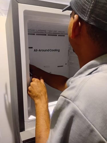 Professional AC technician performing regular maintenance checkup by inspecting HVAC cooler