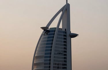 A minimalist, high-end shot of a luxury building silhouette against a soft beige sky, representing the modern architectural landscape of Dubai and the UK.