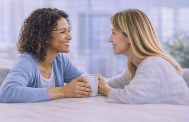 Two women sharing support and encouragement during a health conversation