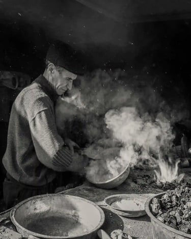 A Peruvian man cooking in a seafood restaurant