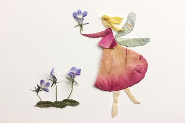 Creative floral art featuring a whimsical fairy made from pressed flower petals and leaves.