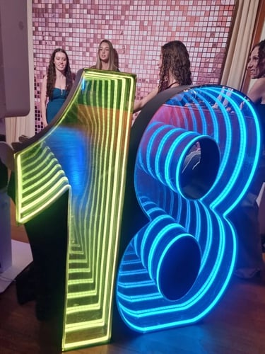 Infinity Numbers glowing bright during an 18th Birthday in Mudgeeraba, Gold Coast - party hire by SweetAz Co.