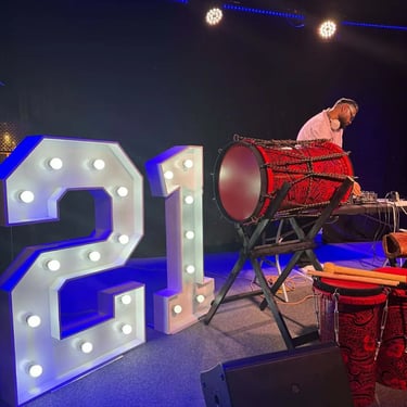 Lightup Numbers setup on stage for a 21st Birthday in Loganholme, Logan - party hire by SweetAz Co.