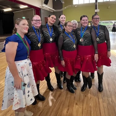Line Dancing team with their coach with their Gold Medals in Nerang, Gold Coast - party hire by SweetAz Co.