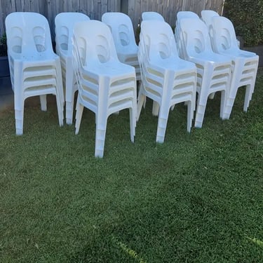 Chairs stacked on the lawn after Gillian's home wedding in Mount Cotton in Redlands.