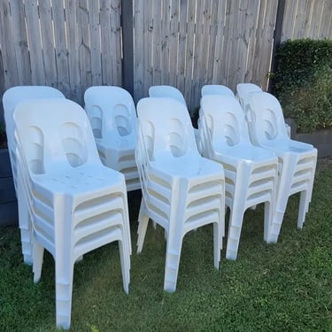 Chairs ready for pickup on the grass after Gillian's wedding at her home in Mount Cotton.
