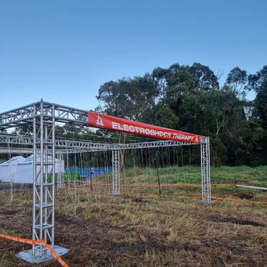 Sweetazco Team staring at the electric shock course at Tough Mudder in Mountcotton, Redlands - party hire by SweetAz Co.