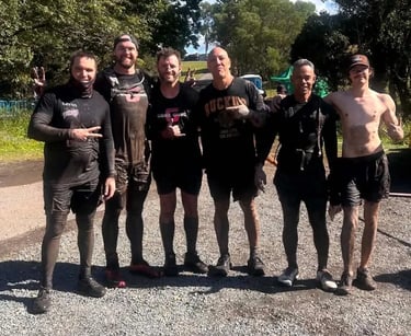 Sweetazco Team group photo after completing 15km Tough Mudder in Mountcotton, Redlands - party hire by SweetAz Co.