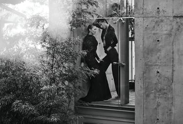 Elizabeth Lotz (Liz Lotz) art director fashion editorial in architectural landscape with two models in black and white elegan