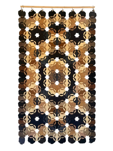 Geometric leather wall hanging Reminiscent of a rug design