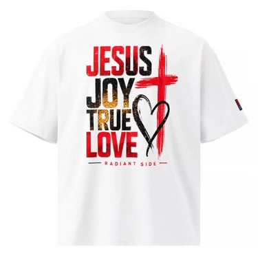 White graphic tee with "JESUS JOY TRUE LOVE" in red, black, and gold, featuring a black cross and heart design, perfect for