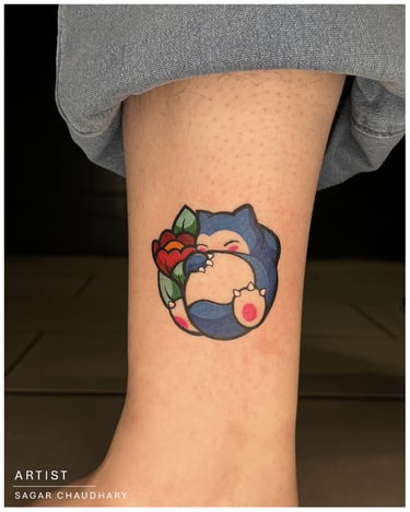 Photo of a color cartoon tattoo above the ankle