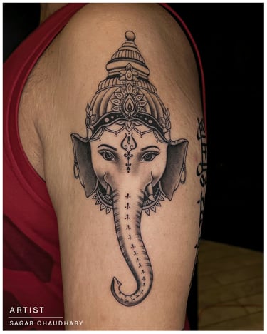 Photo of a ganesha tattoo on the bicep