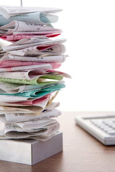 A pile of receipts needing cleaning up