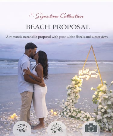 Romantic sunset beach proposal with a couple kissing near white roses and a neon marry me sign.
