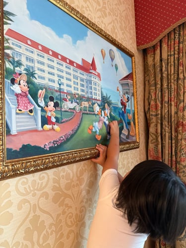 child pointing out to disney characters