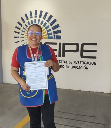 Smiling educator holding an official certificate in front of the CEIPE education research logo.