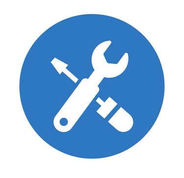 Blue circle icon with a white crossed wrench and screwdriver symbolizing tools and repair services.