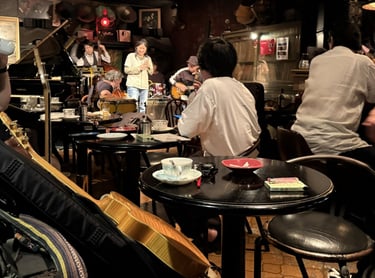 Live jazz musicians performing during a lively evening session in Kurume.
